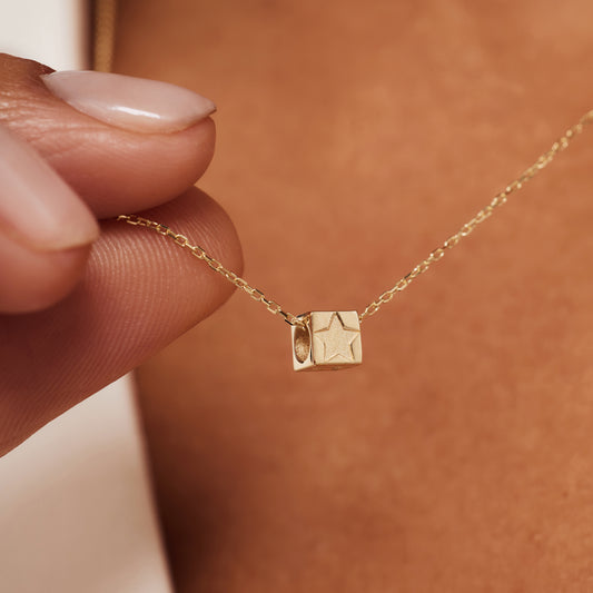 Le Marais Felie 14 karat gold cube charm with star - - Isabel Bernard