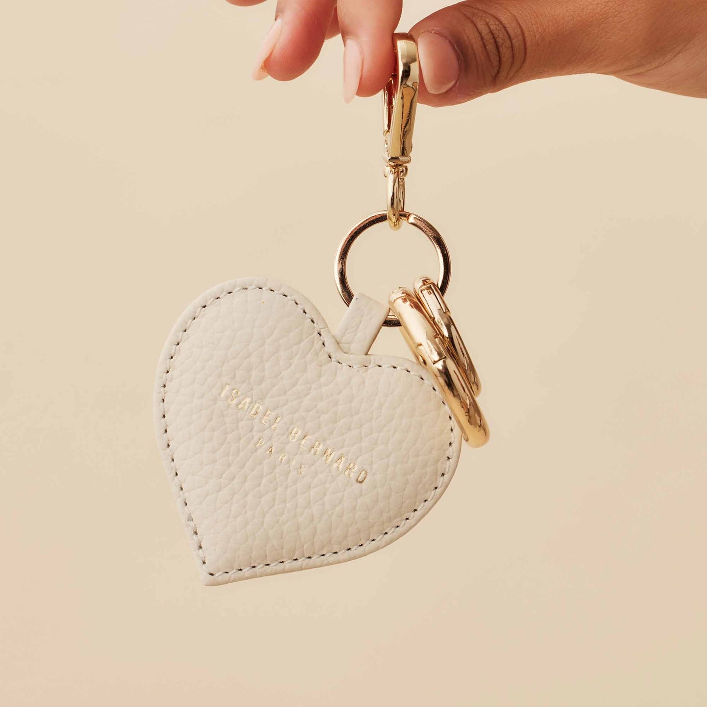 Honoré Faye cream heart key ring - - Isabel Bernard
